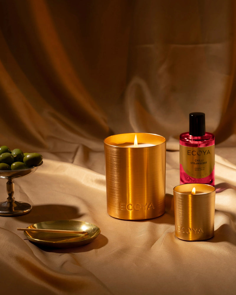 Chilli Strawberry Mini Goldie Candle styled with festive décor on a holiday table