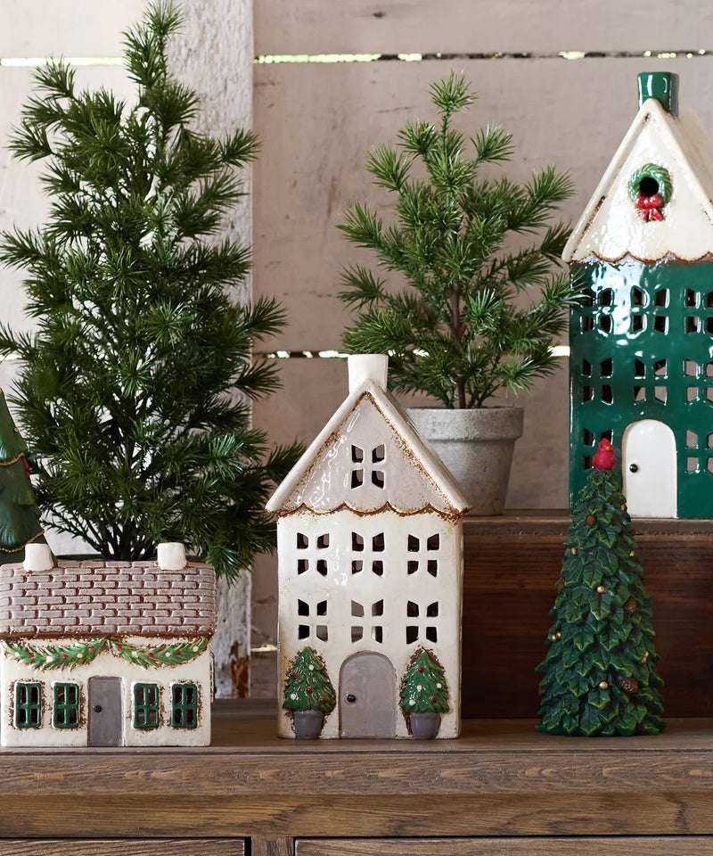 Stone Christmas tealight house styled in festive holiday décor