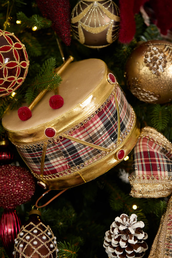 Medium red and green winter tartan Christmas drum decoration – classic festive display piece. Displayed on christmas tree - festive drum.