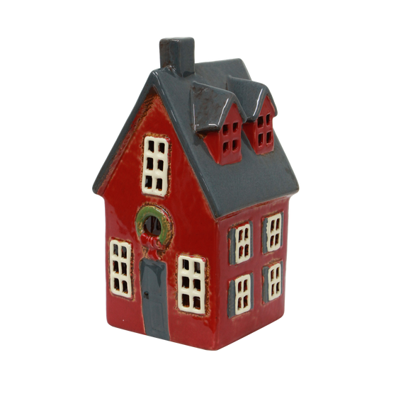 Red ceramic Christmas cottage with wreath