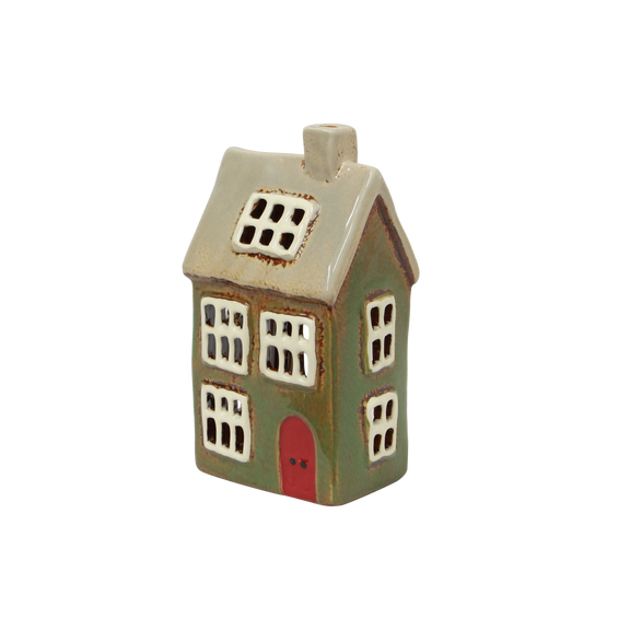 Hand-painted green tealight house styled in a Christmas village scene