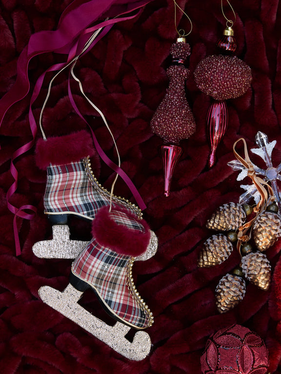 Red and green winter tartan Christmas skates with faux fur trim – festive decorative ornament. Luxery christmas tree decoration or festive home styling.