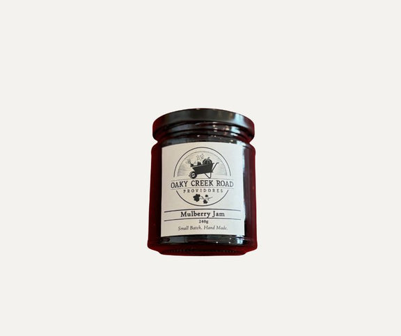 Jar of mulberry jam from Oaky Creek Road on a white background