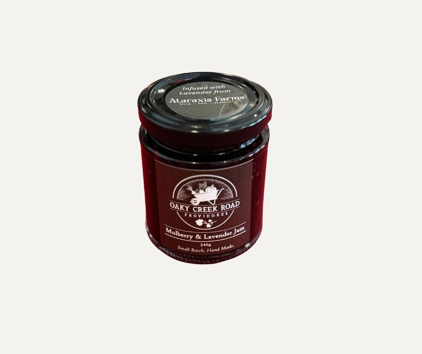 Jar of Oakey Creek Road Provisions mulberry and lavender jam on a white background