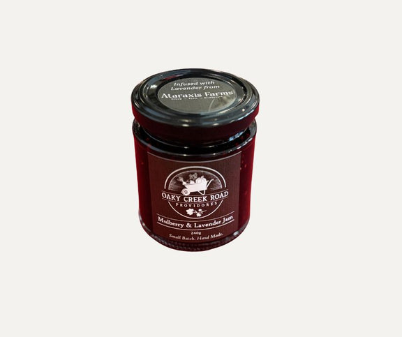 Jar of Oakey Creek Road Provisions mulberry and lavender jam on a white background