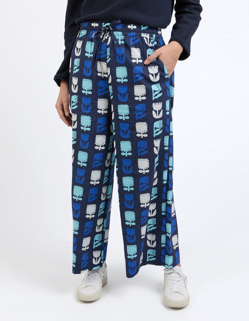 Relaxed-fit navy pants with exclusive Madeleine Stamer design