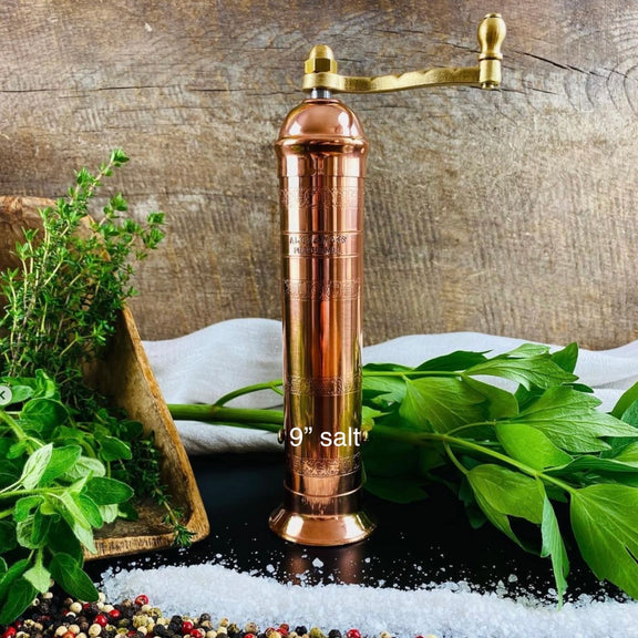 Traditional copper salt mill with crank handle and chiselled detailing