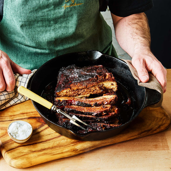 BBQ Bloke’s Spice sprinkled over grilled meat on a barbecue