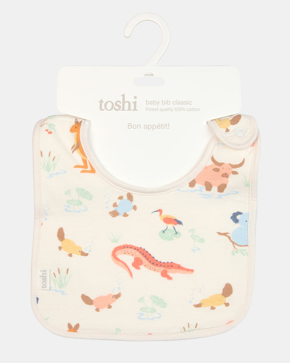 Close-up of the Toshi Kakadu Dawn bib showing exclusive pattern and