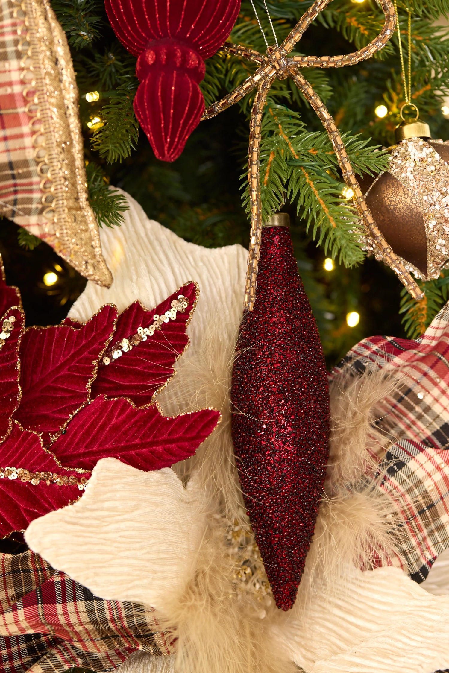 Burgundy caviar long drop Christmas ornament with textured finish – elegant hanging decoration. Red decoration on christmas tree.