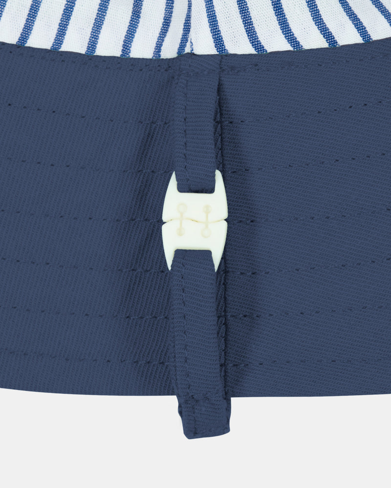 Toshi Midnight bucket hat with structured brim and safety clasp.