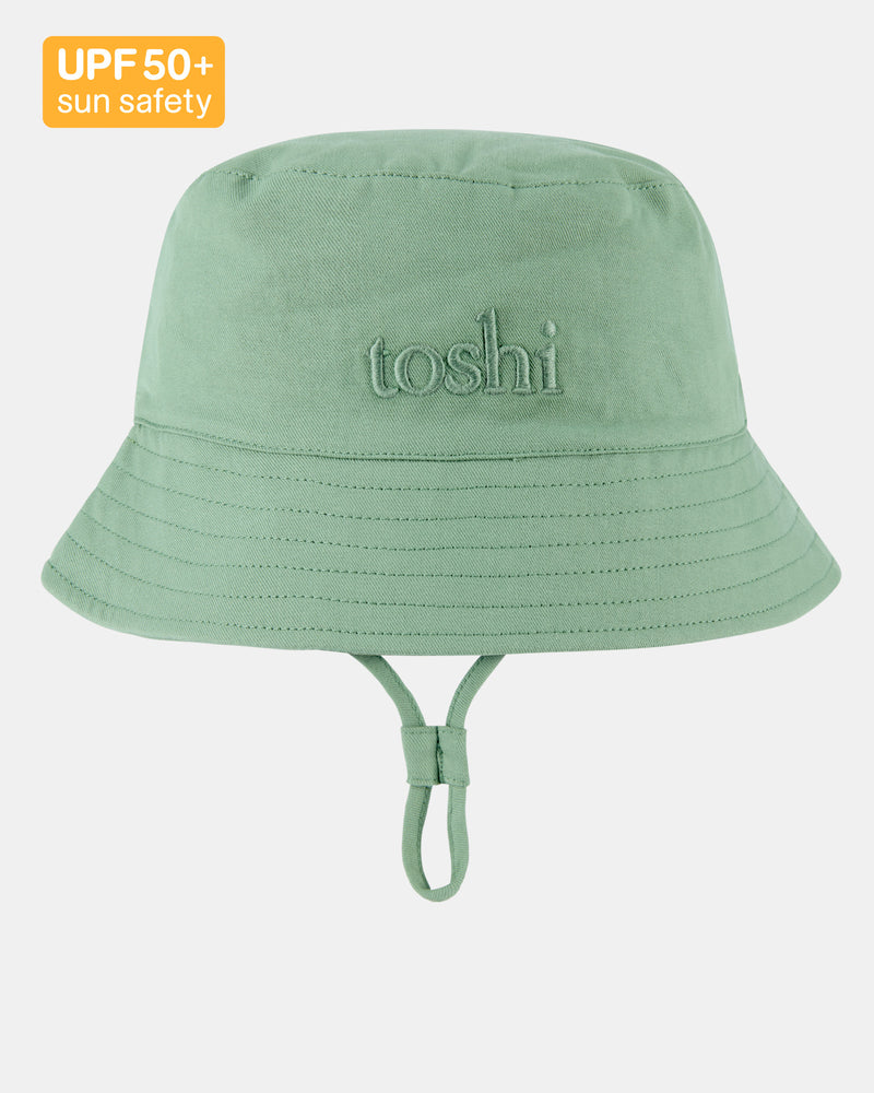 Child wearing Toshi Bucket Hat Billy in Teal with chinstrap and toggle.