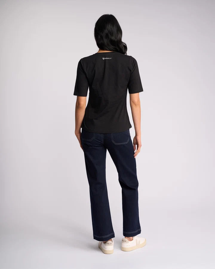 Vassalli Base Tee Black styled as a classic wardrobe staple.