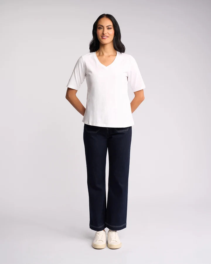 Vassalli Base Tee White styled as an everyday wardrobe essential.