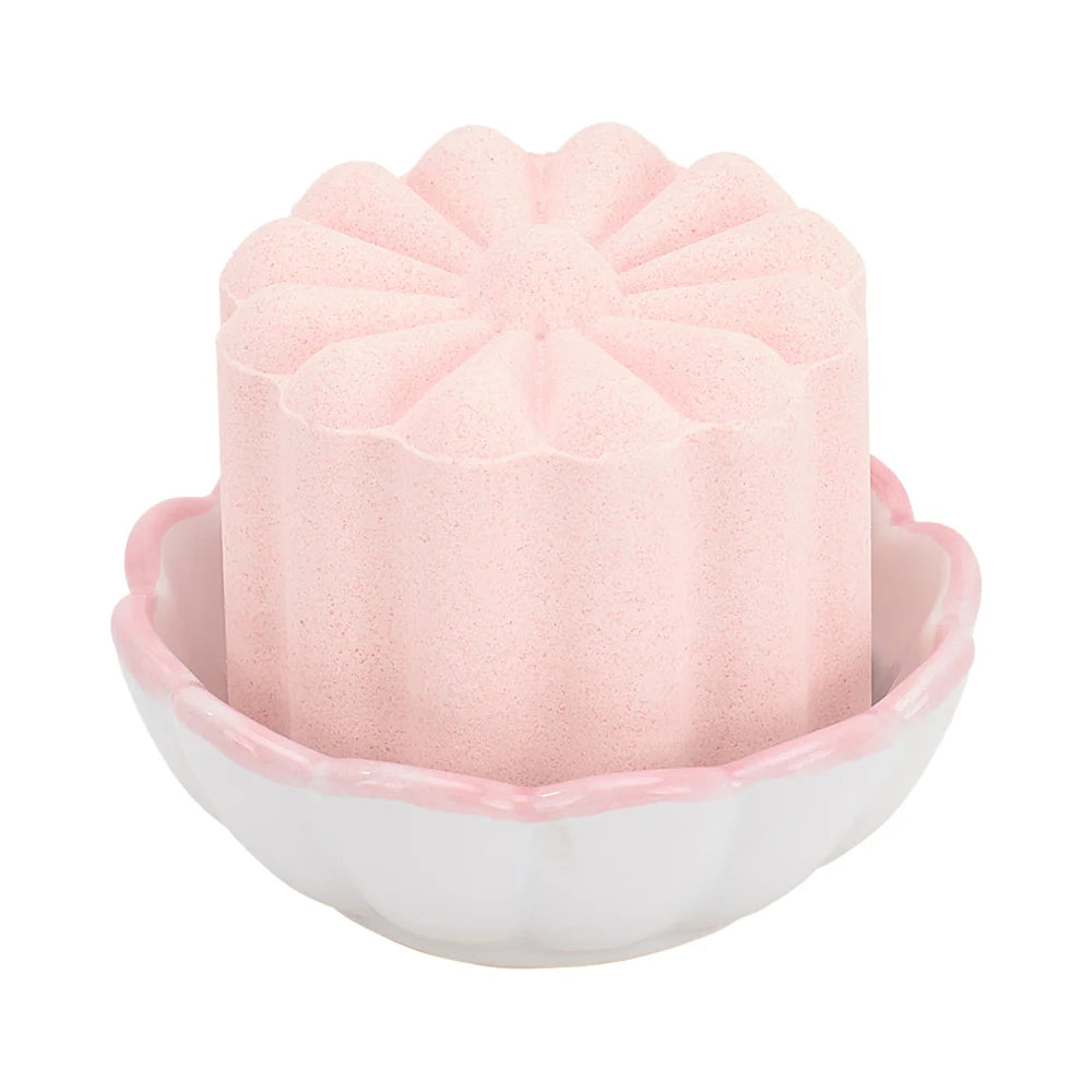 pink shower steamer in small pink and white scollop dish