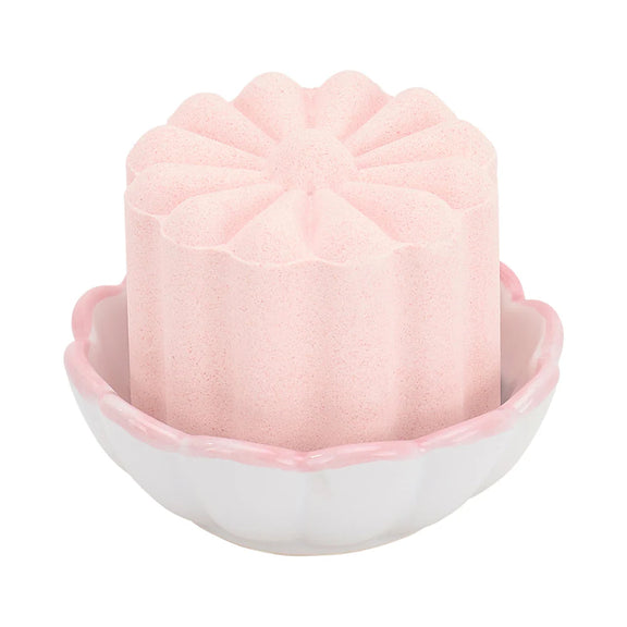 pink shower steamer in small pink and white scollop dish