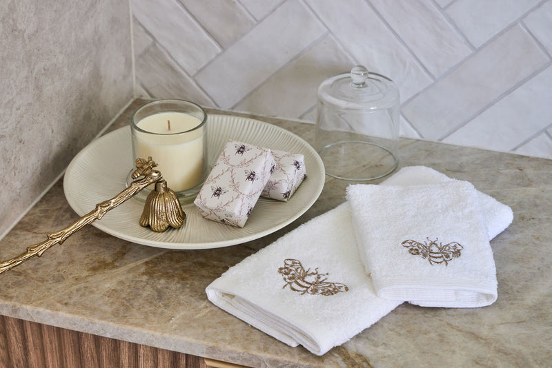 Soft cotton face washer folded neatly beside bathroom accessories.