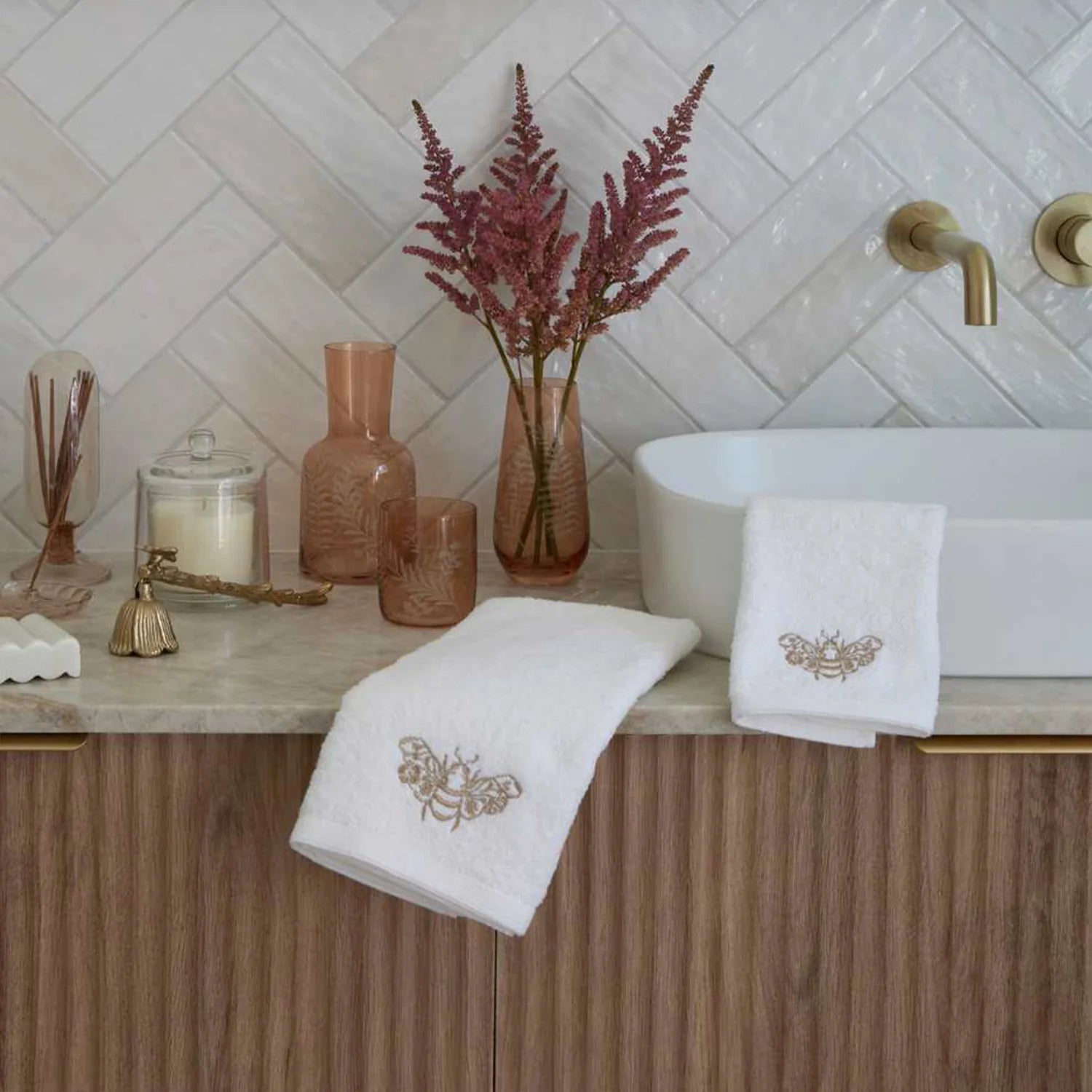 Luxurious cotton hand towel folded neatly on bathroom counter.