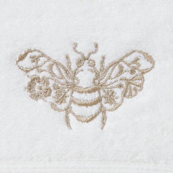 Close-up of gold embroidered motif on Beebee Hand Towel.