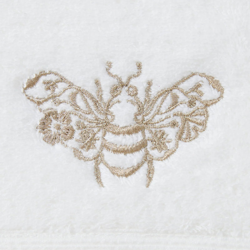 Close-up of gold embroidered motif on Beebee Hand Towel.