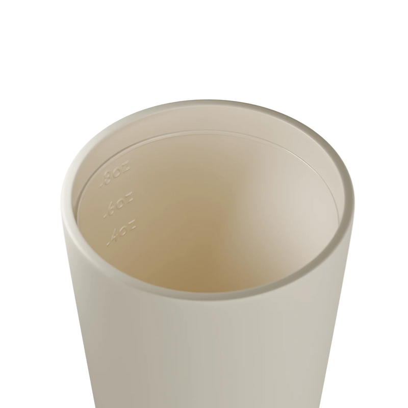 Reusable ceramic-lined coffee cup in Frost with insulated stainless steel body for everyday café drinks. Picture of inside of Frost Bino. 