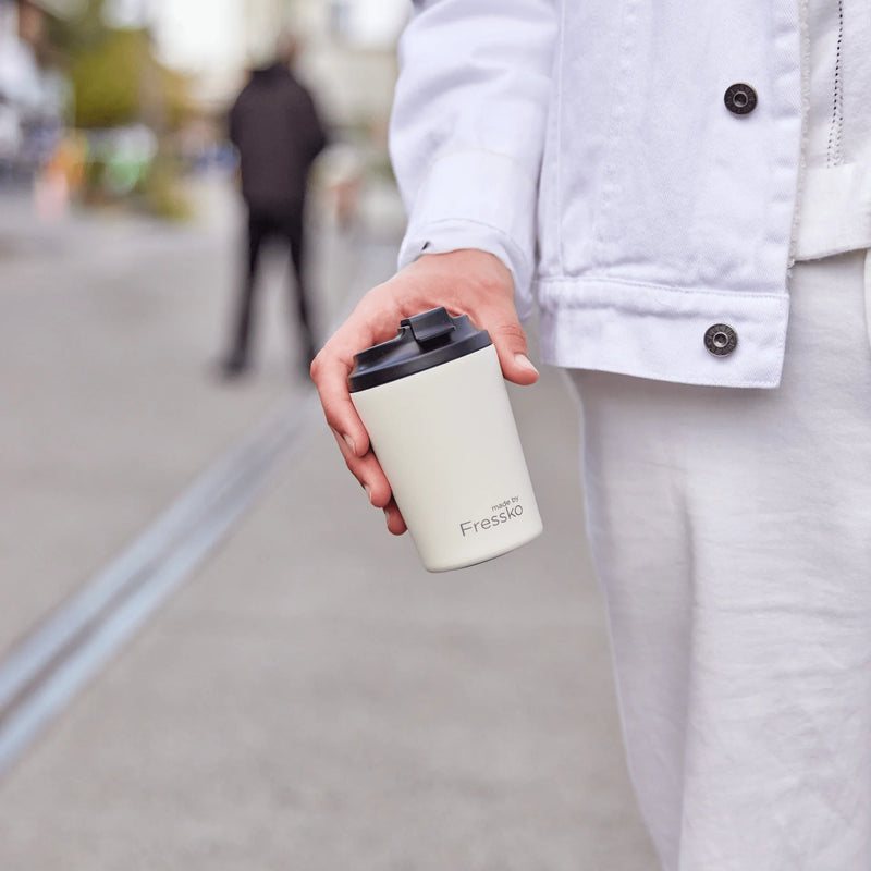 Reusable ceramic-lined coffee cup in Frost with insulated stainless steel body for everyday café drinks.
