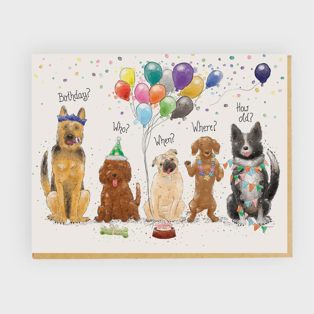 Birthday card with cartoon dogs around balloons and party decorations.