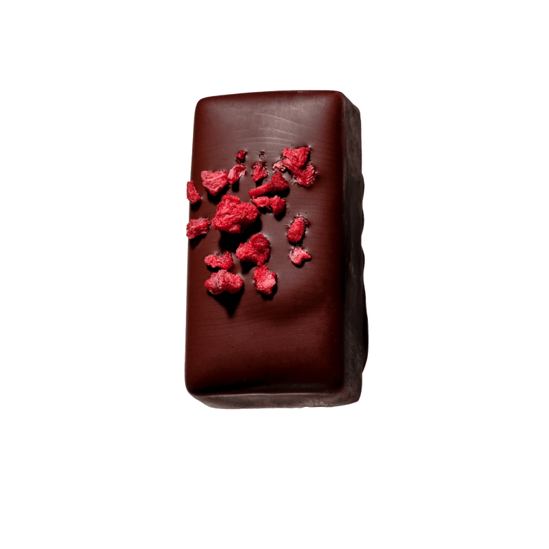 Vegan dark chocolate with sour cherry ganache and freeze-dried raspberry by Loco Love.