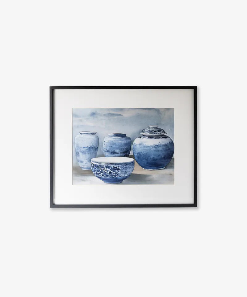 Framed artwork of blue ceramic jars and bowls on a light background