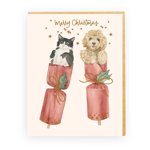 Bon Bon Surprise Christmas card featuring cat and puppy popping from bon bons