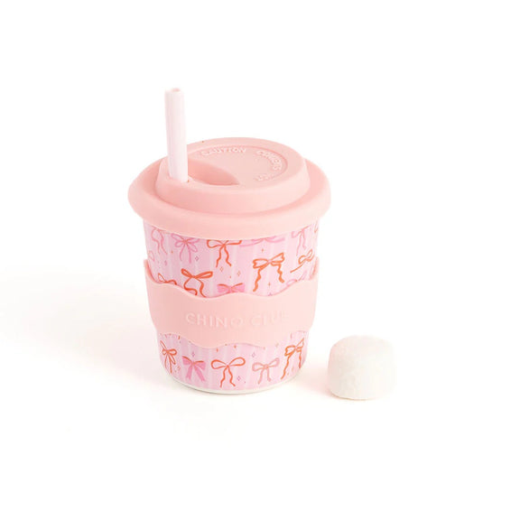 Pink tumbler with bow pattern on a white background. Bows Babychino Cup 8oz by Chino club.