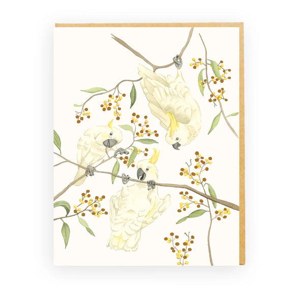 Branching Out gold foil greeting card featuring three illustrated cockatoos on branches