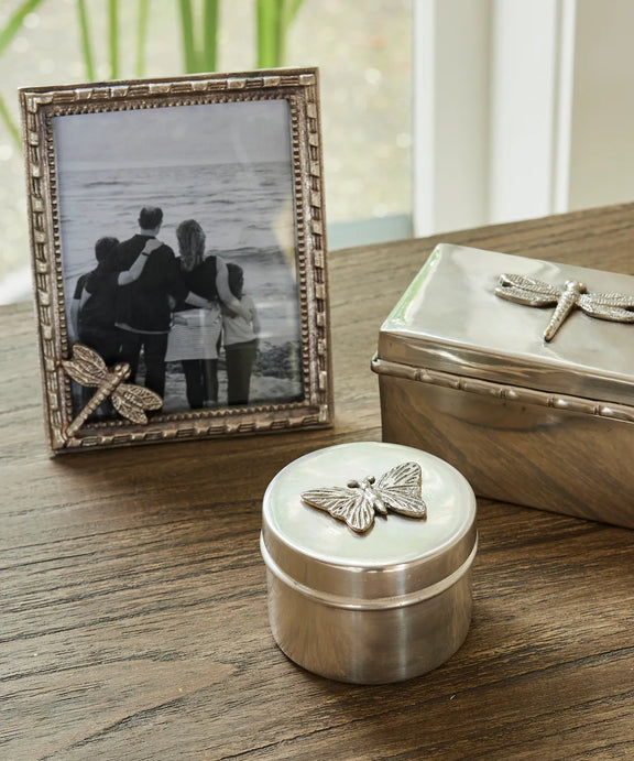 Round silver aluminium canister with butterfly motif