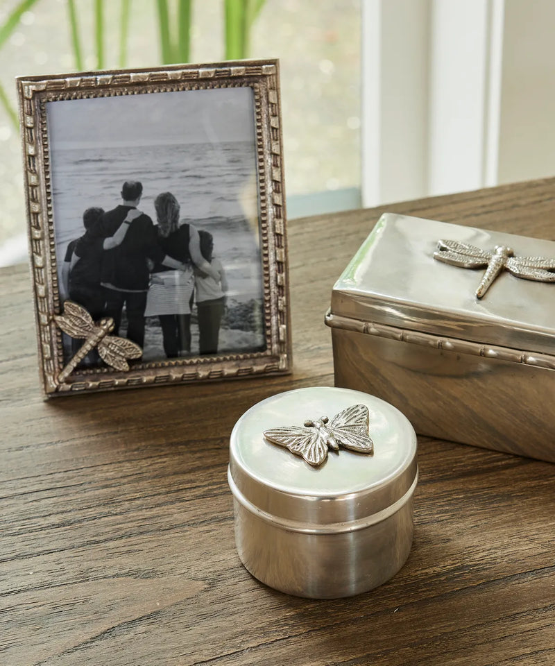 Round silver aluminium canister with butterfly motif