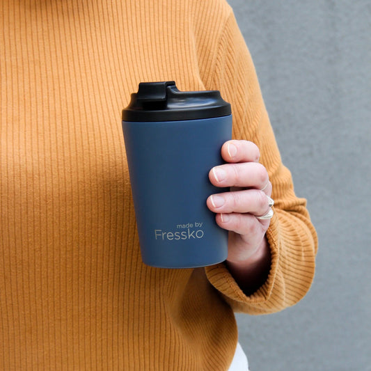 Close up of Camino Denim click back lid and smooth ceramic lining