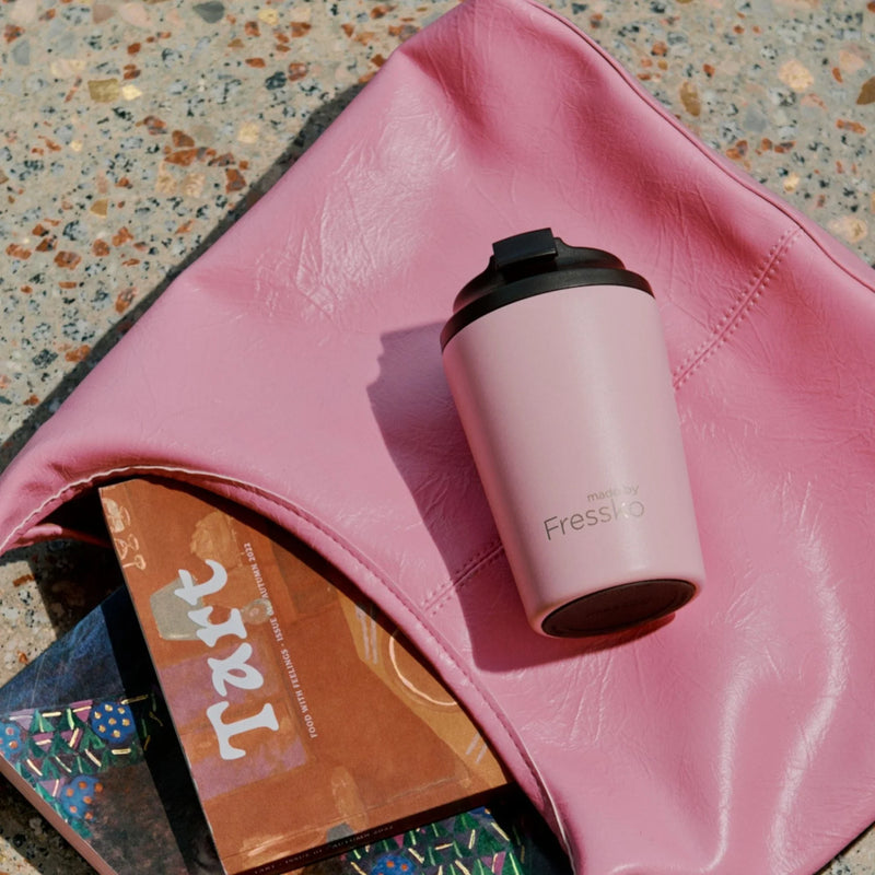 Reusable ceramic-lined coffee cup in Floss with insulated stainless steel body for everyday café drinks.