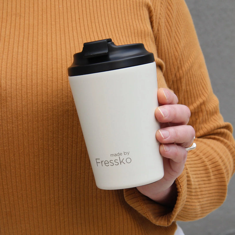 Reusable ceramic-lined coffee cup in Frost with insulated stainless steel body for everyday café drinks.