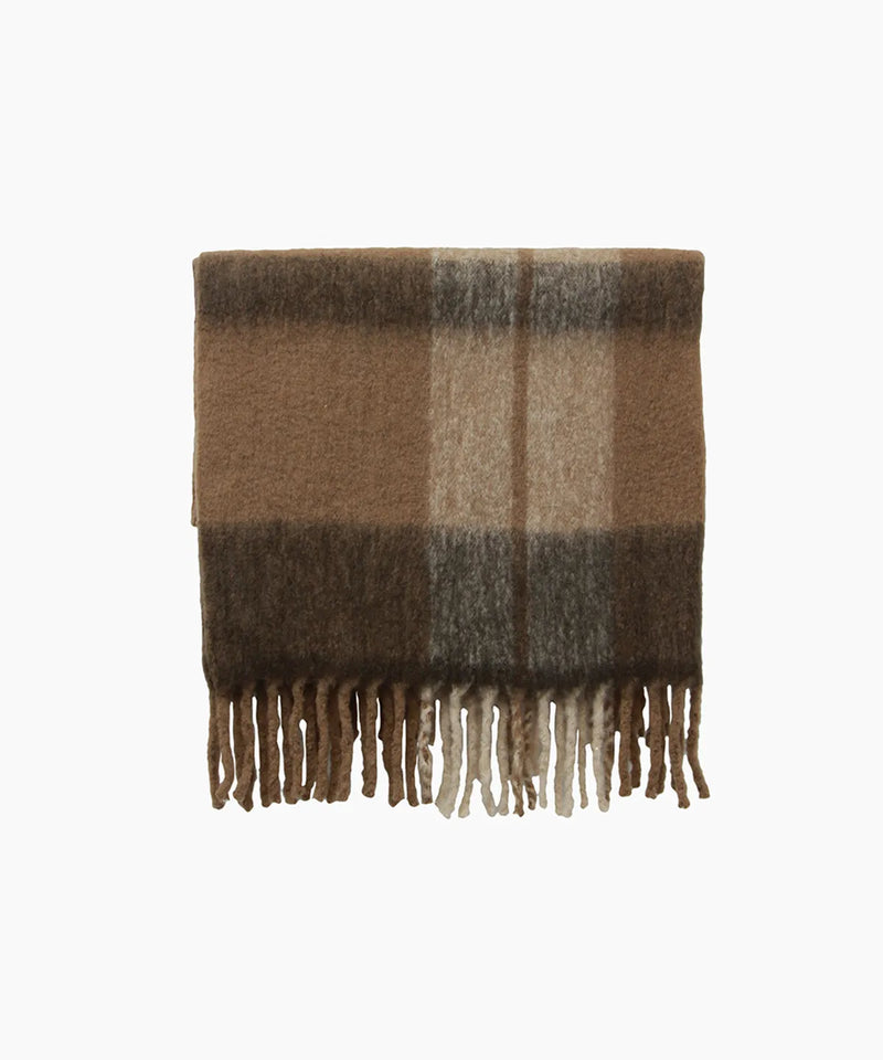 Canopy Plaid Tassel Throw in warm brown, taupe, beige and muted earthy tones with decorative tassels.