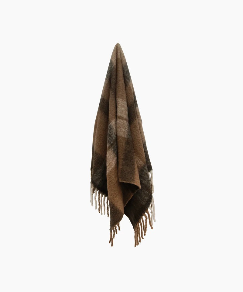 Cosy plaid tassel throw in brown and neutral tones.