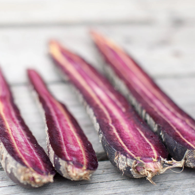 purple carrots cut in half - grown from heirloom seeds