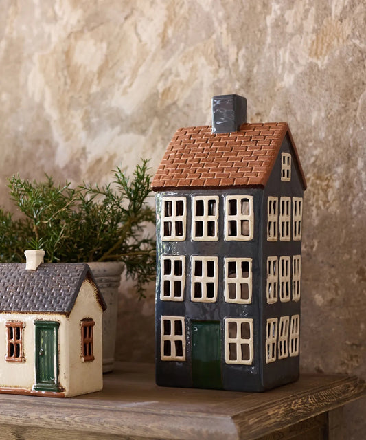 Hand-painted ceramic tea light chalet glowing with candle – Cotswolds décor