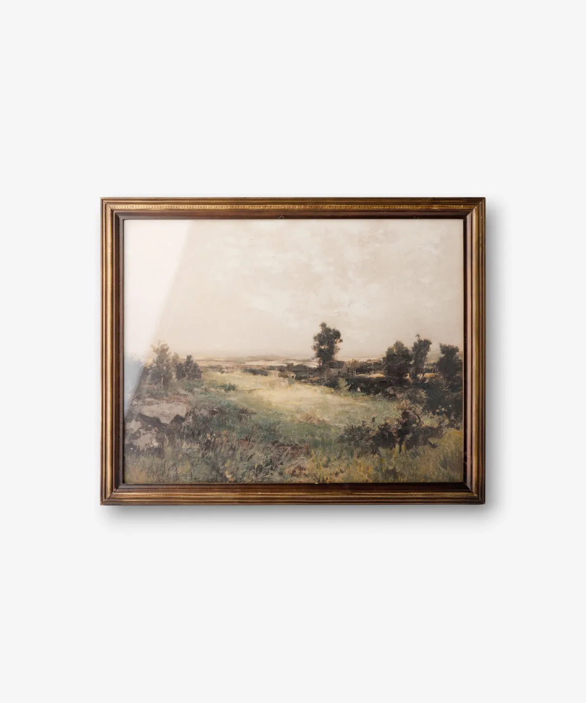 Country landscape framed wall art in rich moody tones with a dark brown timber frame.