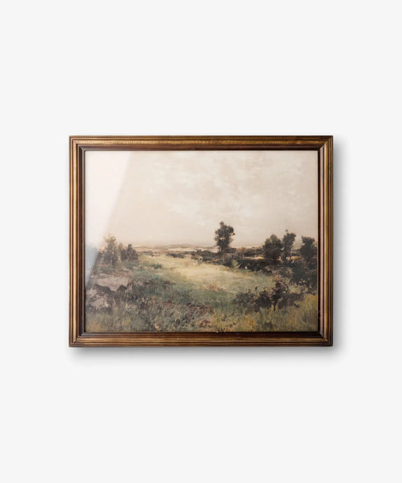 Country landscape framed wall art in rich moody tones with a dark brown timber frame.
