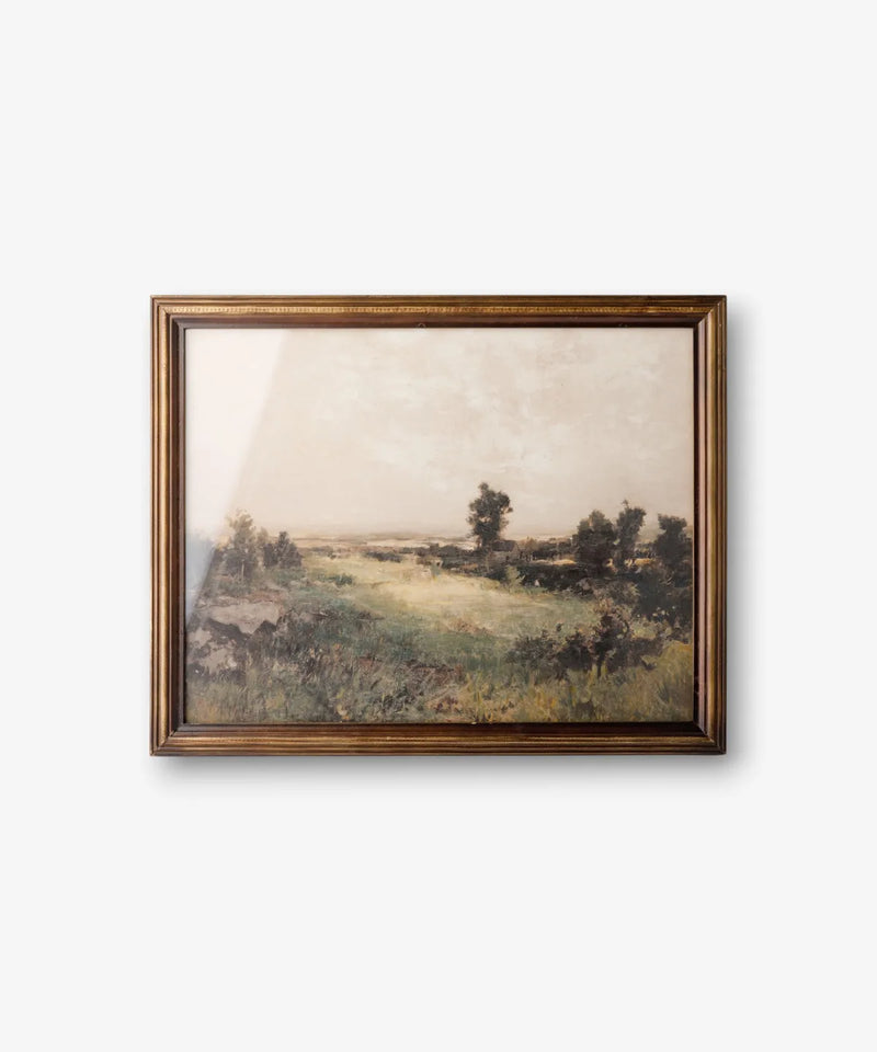 Country landscape framed wall art in rich moody tones with a dark brown timber frame.