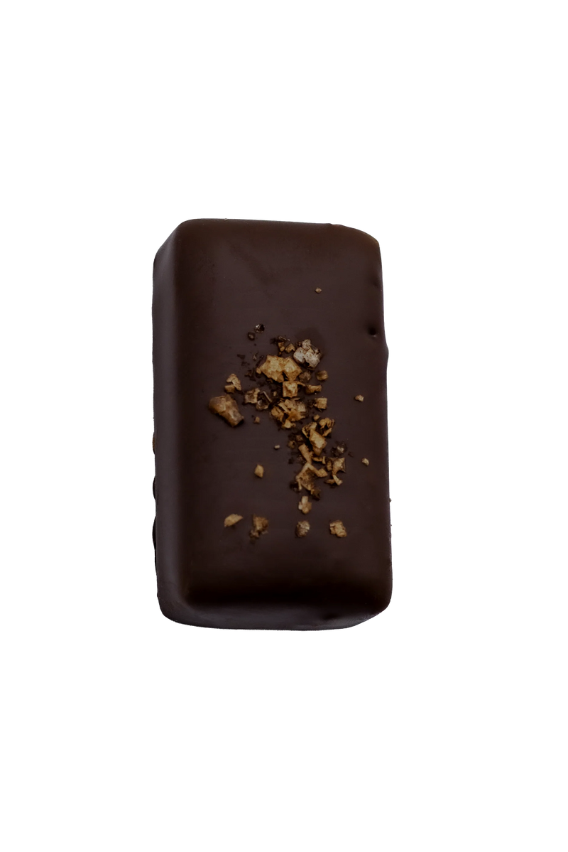 Vegan chocolate truffle by Loco Love with cacao and extra virgin olive oil centre.