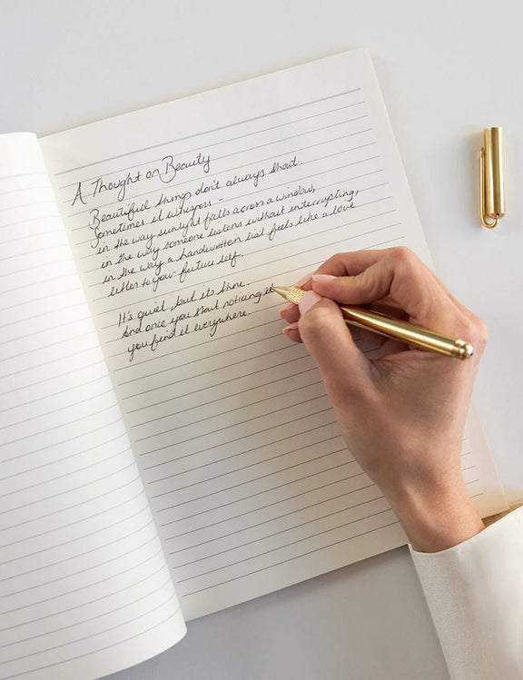 Premium floral notebook with lined pages, gold edges and artist-designed cover.
