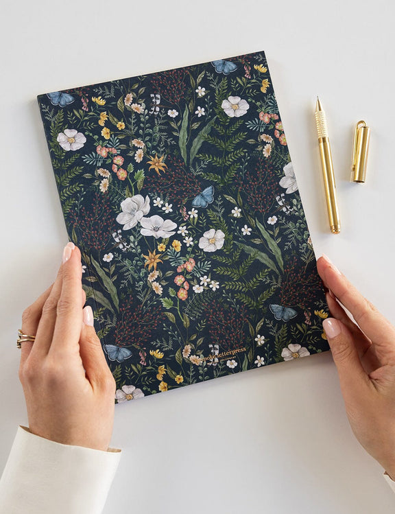 Premium floral notebook with lined pages, gold edges and artist-designed cover.