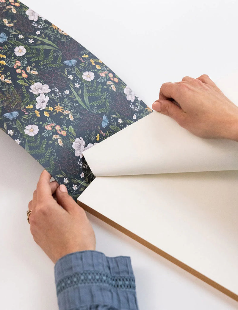 Floral illustrated A4 tear-off notepad by Vicky Lastra with blank pages.
