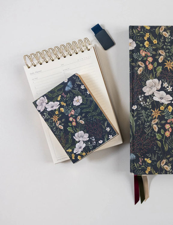 Compact floral notepad with heavyweight blank pages for notes, lists and ideas.