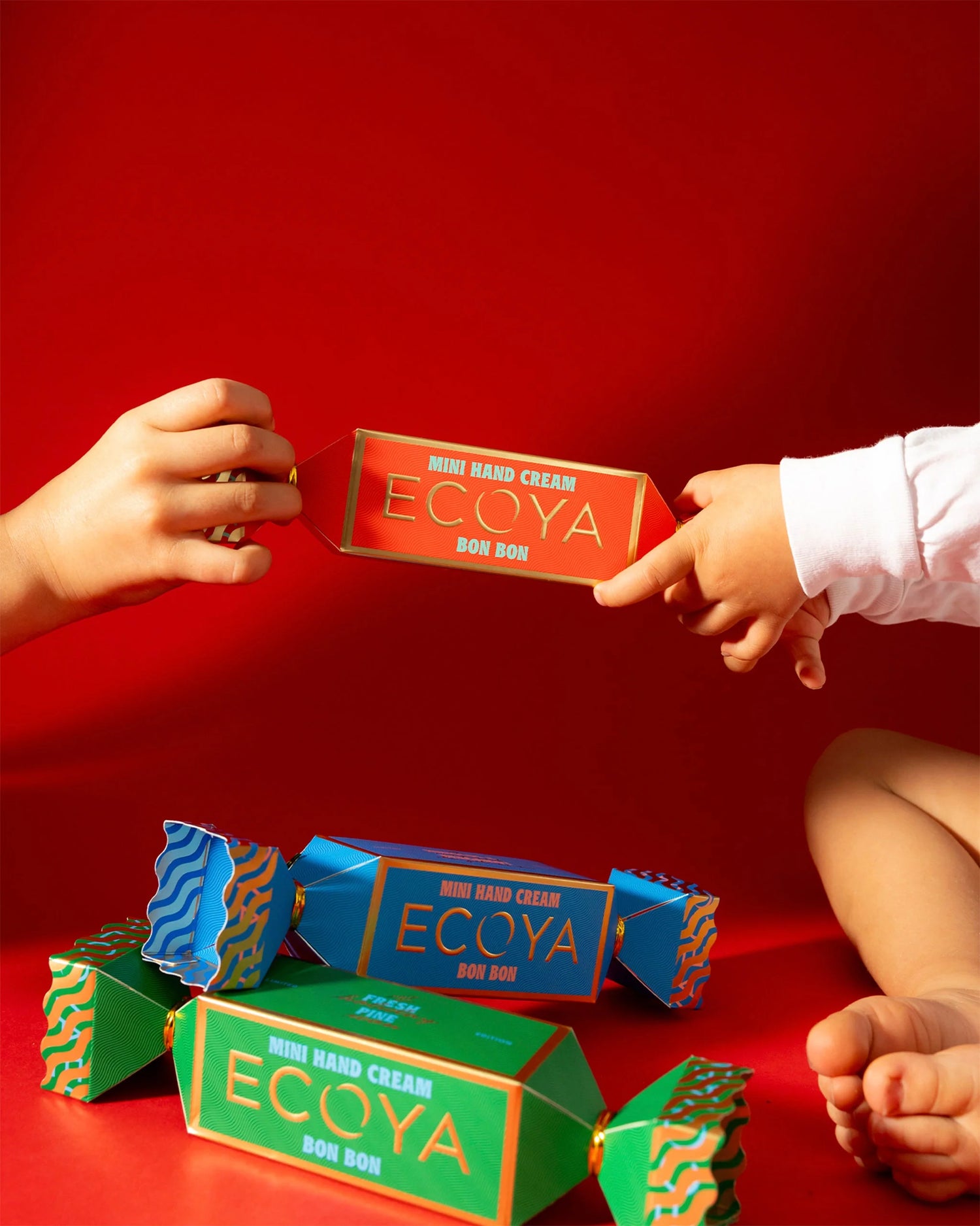 Mini Ecoya Hand Cream Bon Bon in Chilli Strawberry fragrance styled with holiday décor